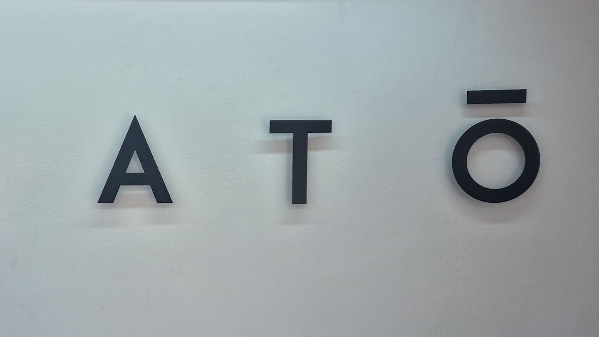 A close up of the word plate on a wall